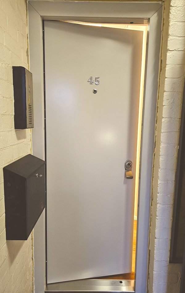 White laminated security door installed in Brick Lane London.