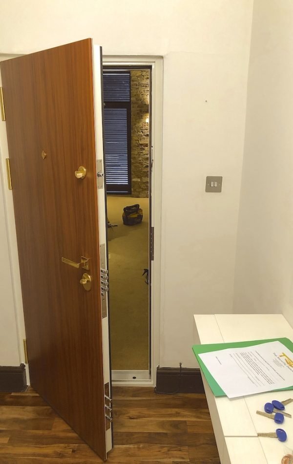 Beautiful security door in plain design, laminated in walnut with additional MOTTURA bolts for the lock.
