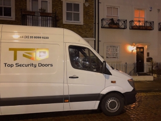 Resistant class 4 security door installed in Knightsbridge along with the bespoke stainless steel grills.