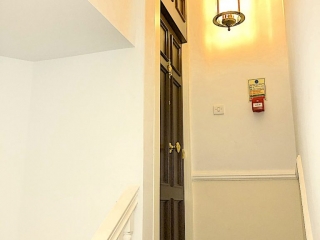 Natural oak cladding on steel security door to match replica design ex wooden door.