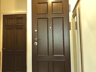 Natural timber - oak and replica design security door with top panel fitted in south west London.