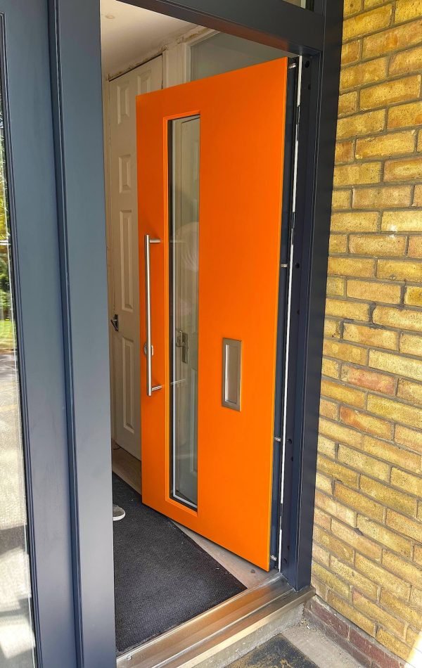 Bright orange high security doors in London.