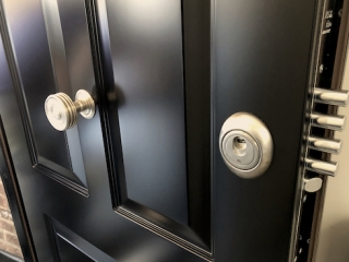 Security door with magnetic cylinder protection from key decoders.
