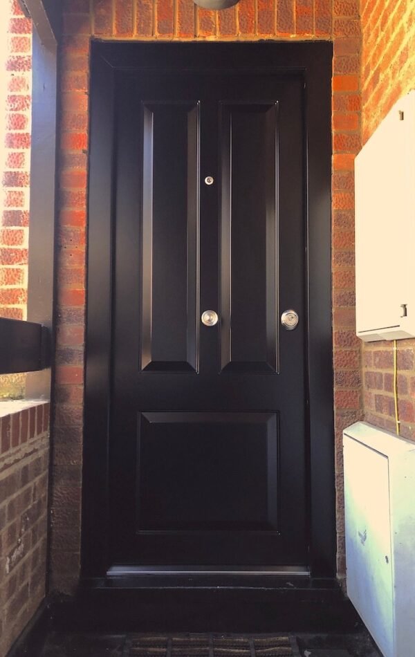 Black, three panel design security doors fitted in Hammersmith.