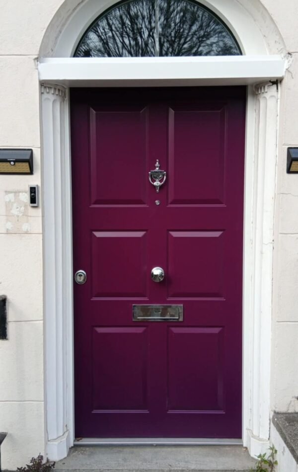 Dark matt pink replica design security door installed in conservation area.